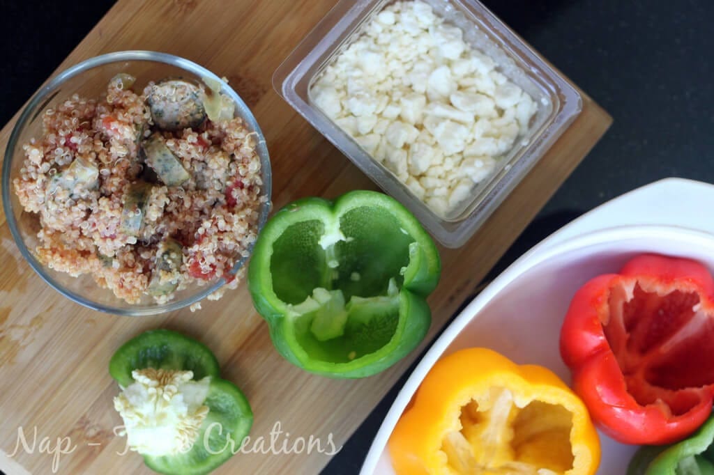 Sausage Stuffed Peppers with Feta ingredients on a cutting board.